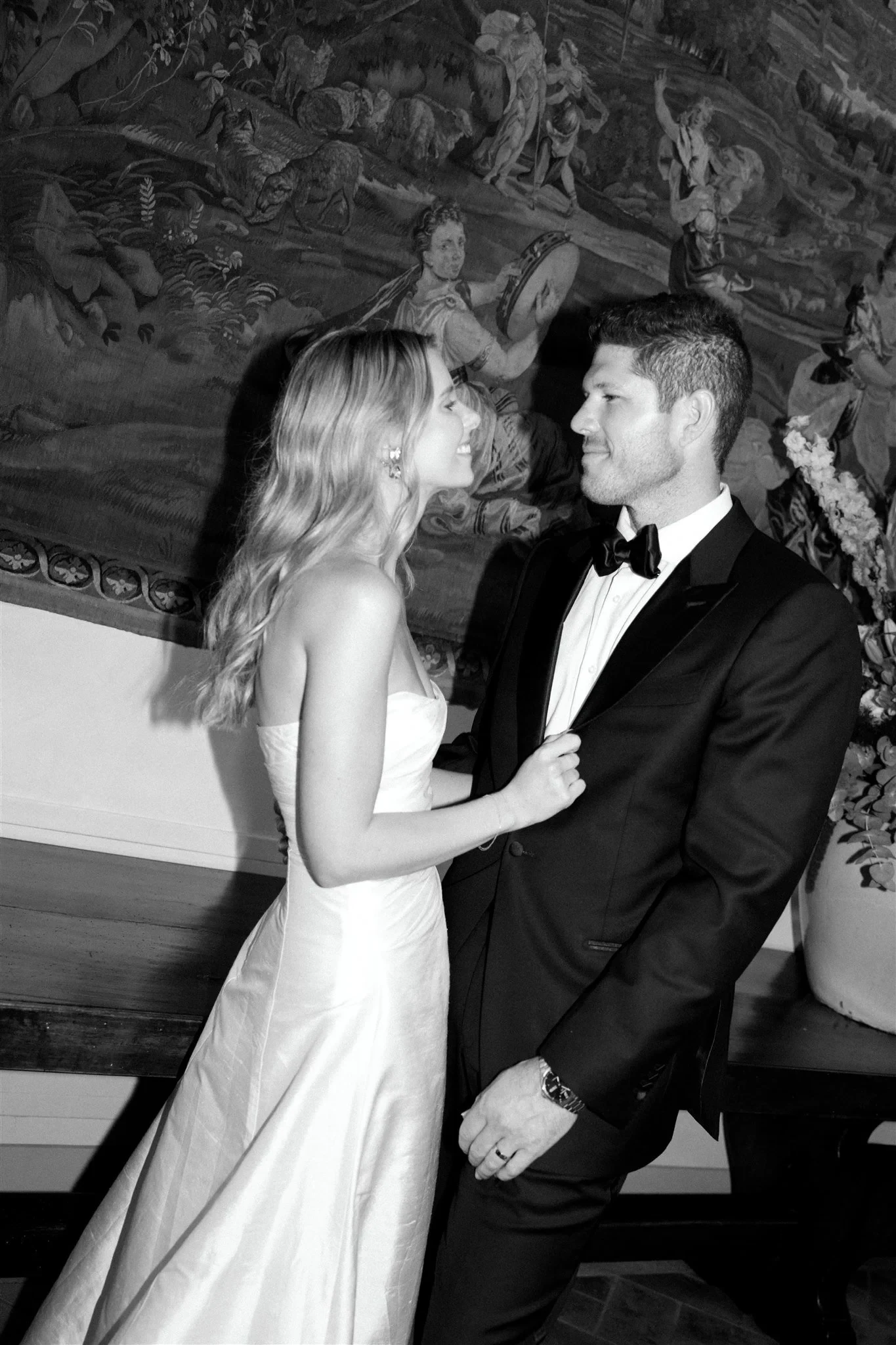Black-and-white portrait of Holly and Matt together beneath a painted vaulted ceiling, at Belmond Villa San Michele in Fiesole, overlooking Florence, Tuscany, Italy, for an Elopement Collective elopement. Photo by Khara from House of Lucie.